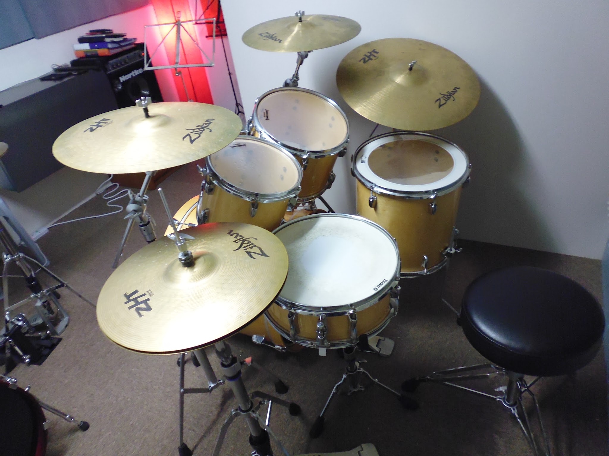 Gold drum kit with cymbals in the practice studio