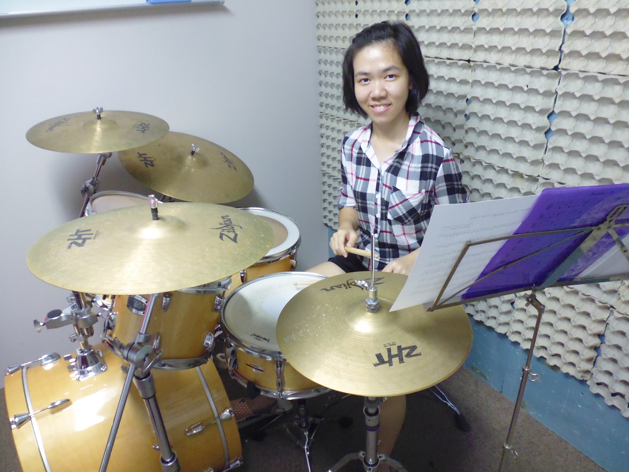 Drum instructor guiding a student