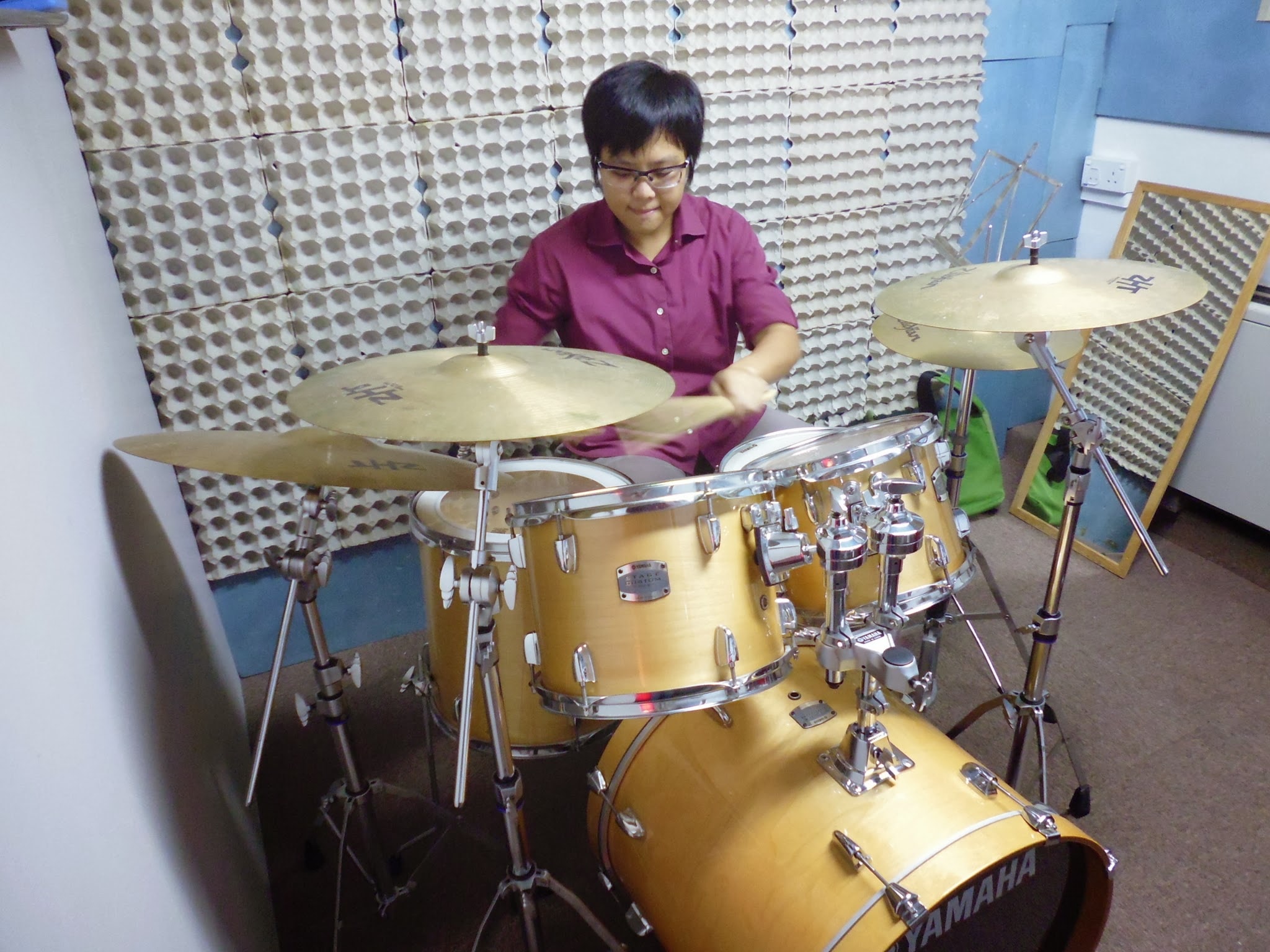 Student practising on a drum kit